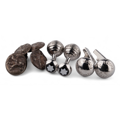 95 - Three pairs of silver cufflinks.To include:[a] An antique pair of putti cufflinks[b] A pair of Louis... 