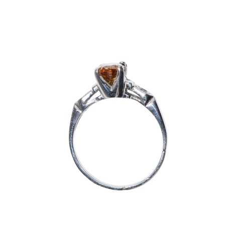 96 - American, circa 1960sA fancy coloured brown diamond ring. The oval shaped diamond weighing approx. 1... 