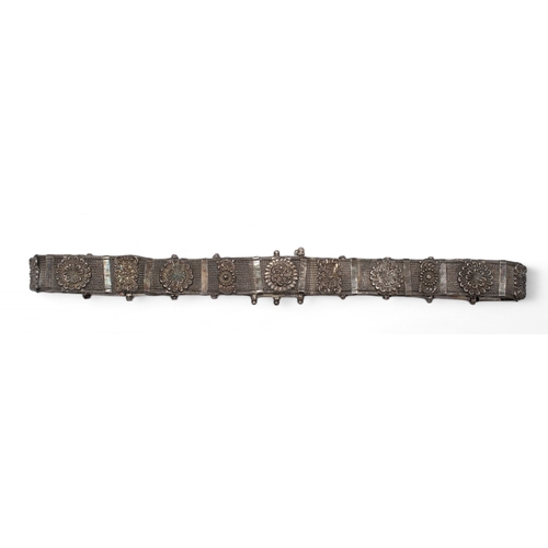 178 - Indian, mid-19th centuryA herringbone, mesh link and repoussé plaque silver belt with coral s... 