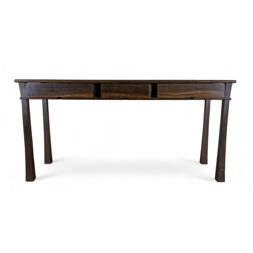 199 - John Makepeace OBE (British, b. 1939)c. 1989A bog oak three-drawer console desk, with fine magnolia ... 