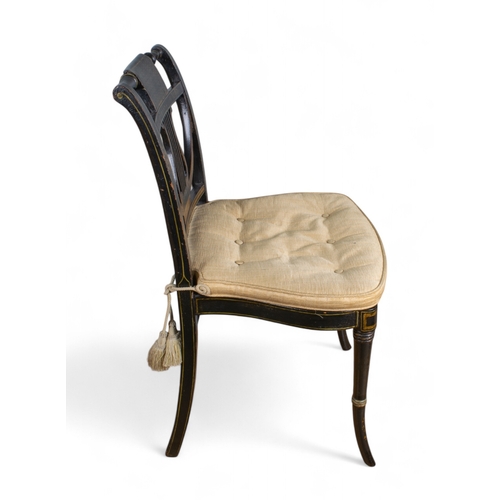 233 - George IIIAn ebonised and parcel gilt side chairWith trellis decoration, over a lyre splat and caned... 