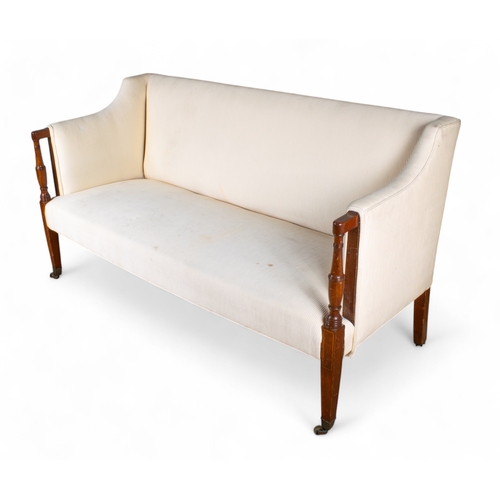 243 - RegencyAn upholstered straight-back sofa with mahogany arms and brass castersProperty of a ladyDimen... 