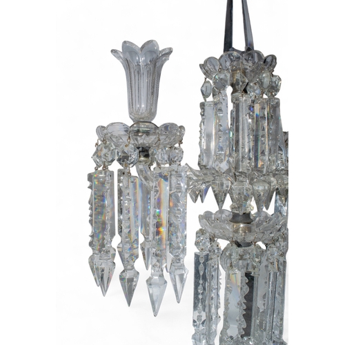 245 - An antique pair of two branch crystal candelabra in Baccarat style. The lobed bobèches with h... 