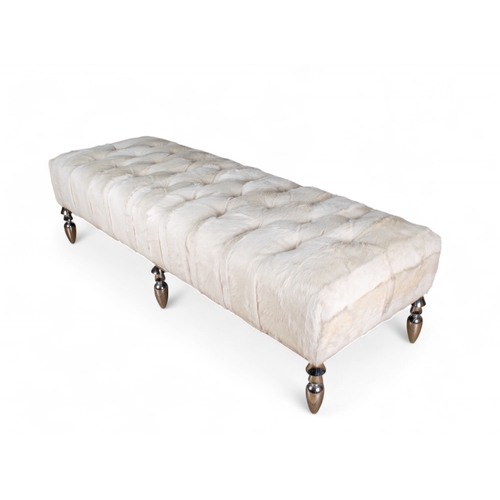 255 - ContemporaryAn ottoman with chrome legs and white goat skin upholsteryDimensions:16 in. (H) x 60 in.... 