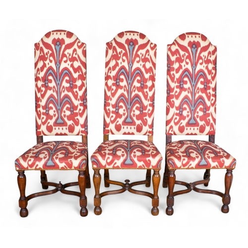 260 - Early 20th century, Carolean styleA set of 12 high-back dining chairs, including two carvers, with c... 