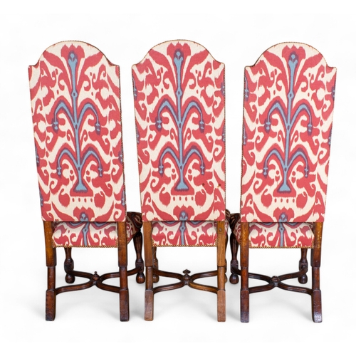 260 - Early 20th century, Carolean styleA set of 12 high-back dining chairs, including two carvers, with c... 