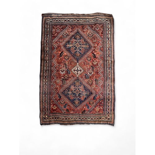 304 - Antique, A Persian rug with blues and reds
Property of a gentlemanFrom the collection of Peter Roe
D... 