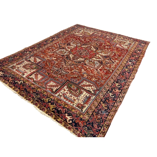 331 - PersianEarly 20th centurya Heriz carpetDimensions:330 cm (L) x 252 cm (W)... 