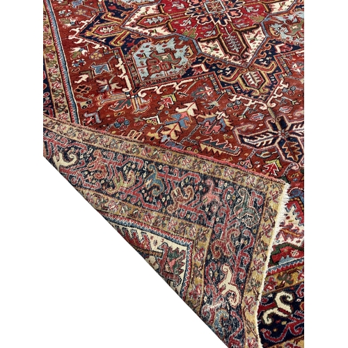 331 - PersianEarly 20th centurya Heriz carpetDimensions:330 cm (L) x 252 cm (W)... 