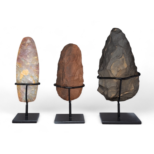 557 - Three flint handaxesPaleolithic-Neolithic period, circa 200,000-6,000 B.C. Including a Saharan ... 