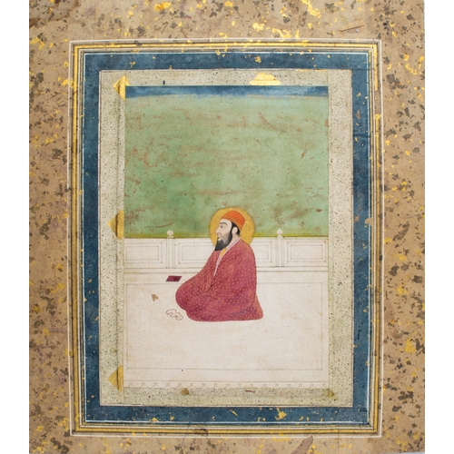 561 - Indian19th centuryA seated man with prayer beadsOpaque pigments heightened with goldOld stamp versoD... 