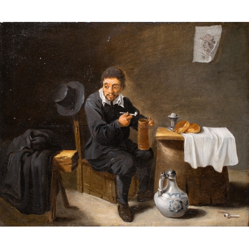 413 - Circle of David Teniers the Younger (Flemish, 1610-1690)A pipe smoker in an interiorOil on cradled p... 