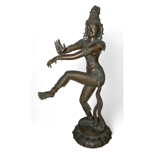 505 - South IndianA large dancing goddess, possibly ParvatiBronzeThe right hand raised in abhaya mudra (gi... 