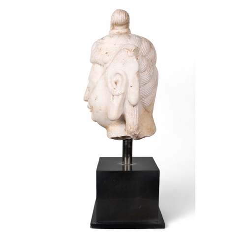 510 - Chinese, 8th centuryA rare Tang Dynasty (?) white marble head of Kuan Yin.Dimensions:(Excl. base) 9 ... 