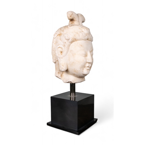 510 - Chinese, 8th centuryA rare Tang Dynasty (?) white marble head of Kuan Yin.Dimensions:(Excl. base) 9 ... 