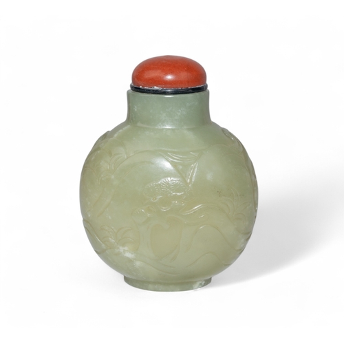 517 - Chinese, 18th/19th centuryA fine mutton fat coloured jade bombé snuff bottle, carved with fig... 