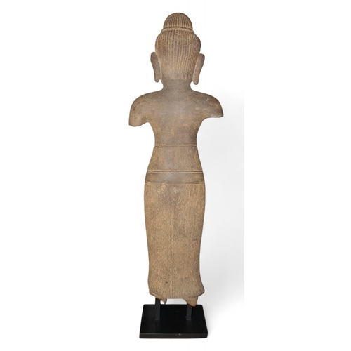 525 - Cambodian, 11th century (?)A grey sandstone standing figure with finely carved features and hair.Dim... 