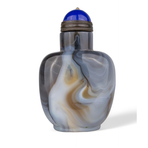 531 - Chinese, Qing dynasty, 19th centuryA large banded agate snuff bottle with blue Peking glass stopper.... 