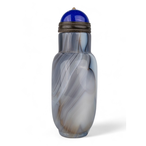 531 - Chinese, Qing dynasty, 19th centuryA large banded agate snuff bottle with blue Peking glass stopper.... 