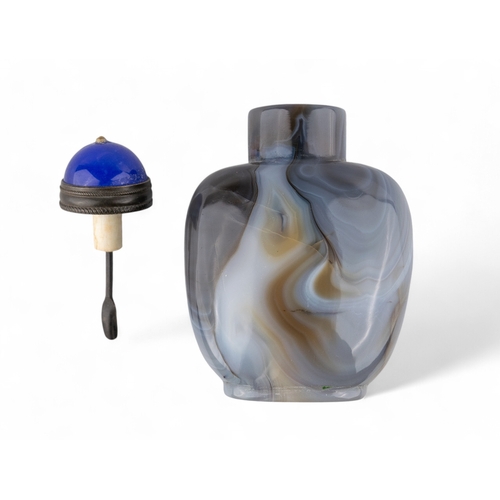 531 - Chinese, Qing dynasty, 19th centuryA large banded agate snuff bottle with blue Peking glass stopper.... 