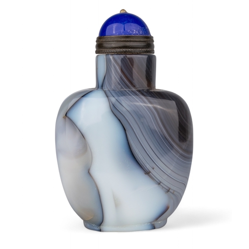 531 - Chinese, Qing dynasty, 19th centuryA large banded agate snuff bottle with blue Peking glass stopper.... 