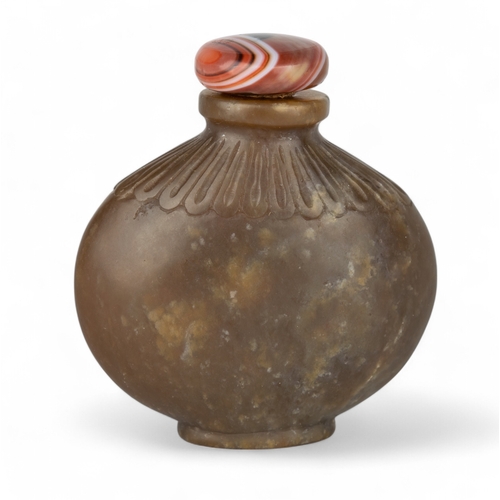 532 - Chinese, Qing dynasty, 18th/19th centuryAn attractive carved brown jade snuff bottle of ovoid squat ... 