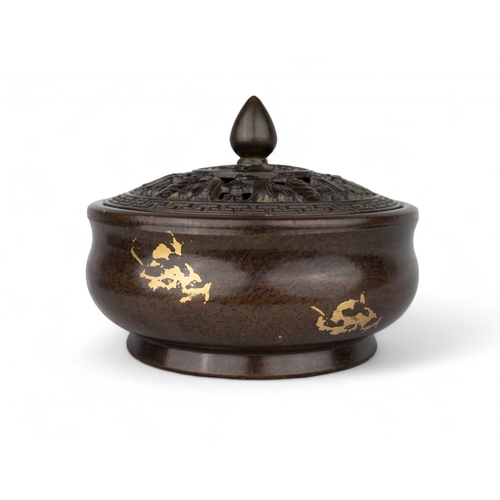 539 - Chinese, Late Qing dynastyA small bronze gold splash censer of squat form with a removable bronze li... 