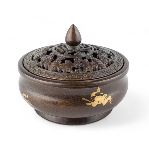 539 - Chinese, Late Qing dynastyA small bronze gold splash censer of squat form with a removable bronze li... 