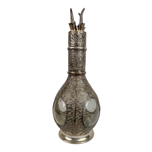 542 - Chinese, Circa 1900A Chinese silver encased French glass liqueur decanter.The decanter designed as f... 