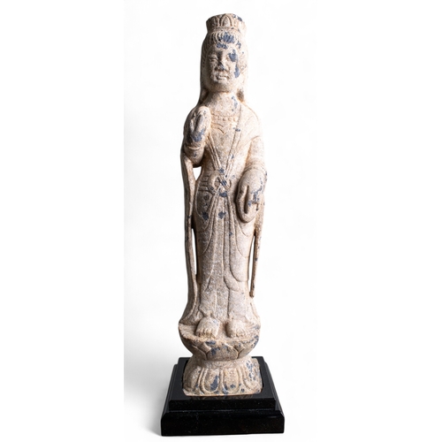 543 - Chinese, 7th/8th centuryA carved grey marble standing Tang Dynasty figure of a lady with headdress o... 