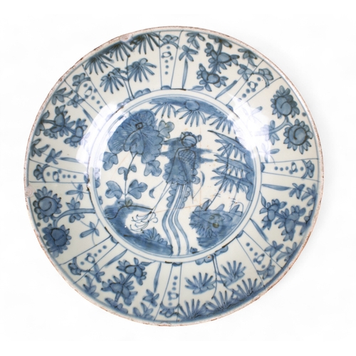 549 - Chinese, Ming DynastyA large blue and white Swatow ware bowl, adorned in radiating floral panels enc... 