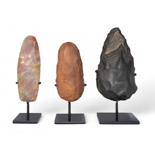 557 - Three flint handaxesPaleolithic-Neolithic period, circa 200,000-6,000 B.C. Including a Saharan ... 