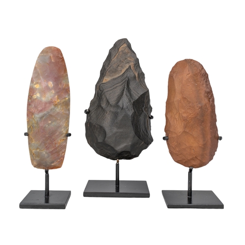 557 - Three flint handaxesPaleolithic-Neolithic period, circa 200,000-6,000 B.C. Including a Saharan ... 