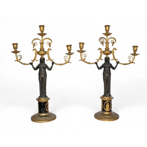 654 - French EmpireA pair of patinated brass and ormolu figural candlesticksProvenance: Paintings, Furnitu... 