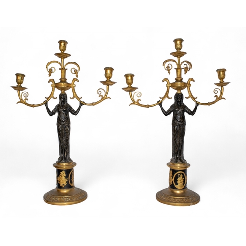 654 - French EmpireA pair of patinated brass and ormolu figural candlesticksProvenance: Paintings, Furnitu... 