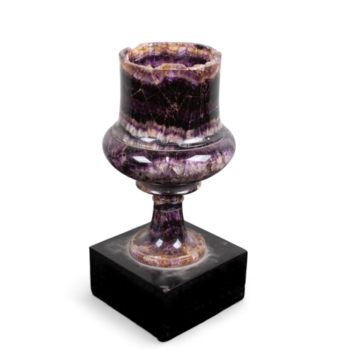 657 - A Blue John chalice, of deep purple hue.On a black slate base.To be sold without reserveDimensions:(... 