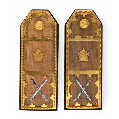 674 - Iranian, 1950sA pair of gilded and silver metal epaulettes with the crown and cross swords motif, an... 