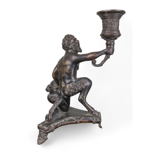 683 - Italian16th century and laterA bronze inkstand in the form of a kneeling satyr holding a torch. The ... 