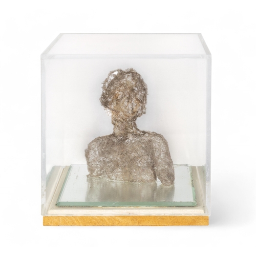 692 - 20th centuryA fibreglass bust of a figure in a plexiglass case on a mirrored base.Together with a sm... 