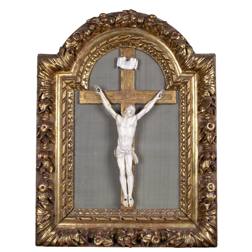 707 - Italian or German17th centuryAn ivory crucifixThe figure of Christ and banner with ‘INRI’ in ivory, ... 