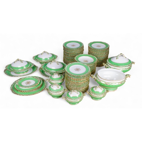 733 - A Rockingham china dinner set with green borders and gilt decoration.To include:[a] Four small turee... 