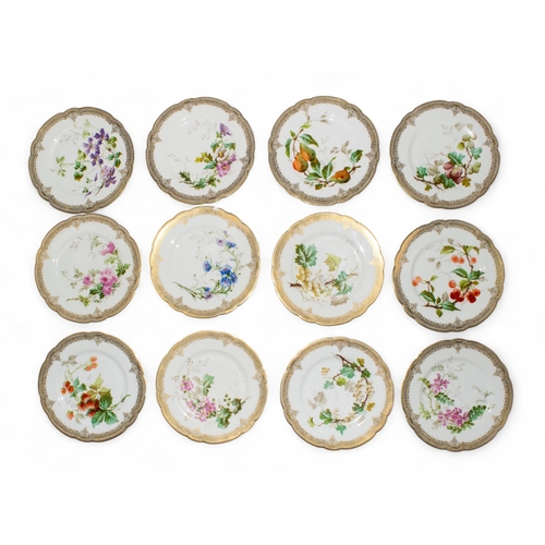 740 - Mansard Paris 34 Rue ParadisA set of twelve porcelain dinner plates with gilt borders and floral dec... 