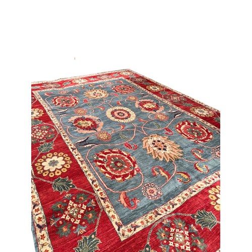 330 - Circa 1980An Agra carpet in blues and redsDimensions:493 cm (L) x 357 cm (W)... 