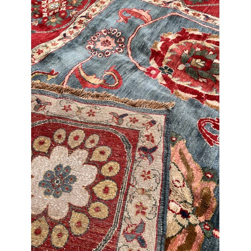 330 - Circa 1980An Agra carpet in blues and redsDimensions:493 cm (L) x 357 cm (W)... 