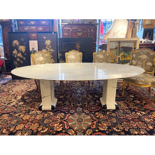 248A - ContemporaryA large oval marble table on two fluted black and white marble columnsDimensions:27.5 in... 