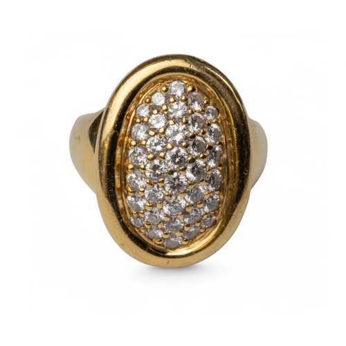 8A - Cartier, circa 1994An 18 carat gold diamond cluster ring. The oval shaped bombé pavé set diamond top... 