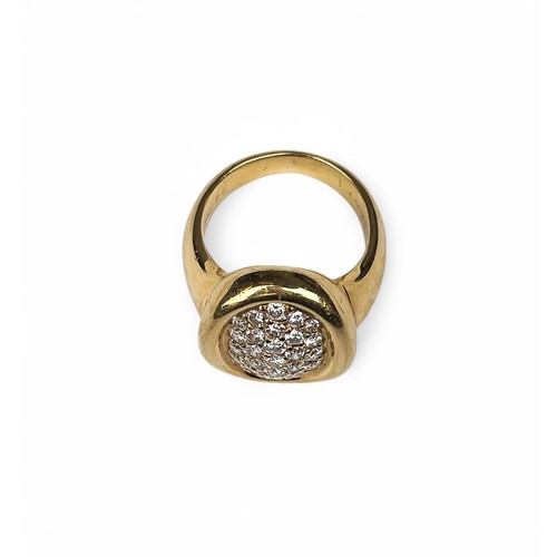 8A - Cartier, circa 1994An 18 carat gold diamond cluster ring. The oval shaped bombé pavé set diamond top... 