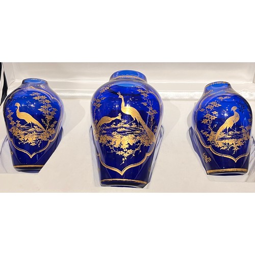 207 - James Giles (British, 1718-1780), circa 1770A rare trio of Bristol blue glass vases with gilt peacoc... 