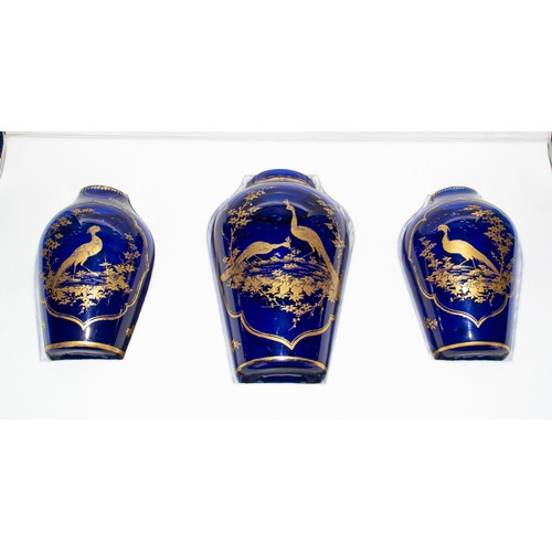 207 - James Giles (British, 1718-1780), circa 1770A rare trio of Bristol blue glass vases with gilt peacoc... 