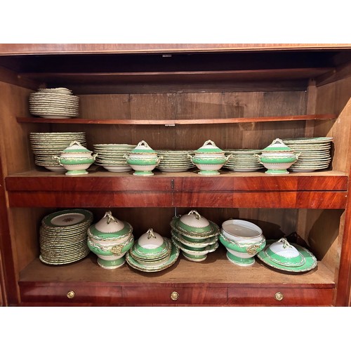 733 - A Rockingham china dinner set with green borders and gilt decoration.To include:[a] Four small turee... 